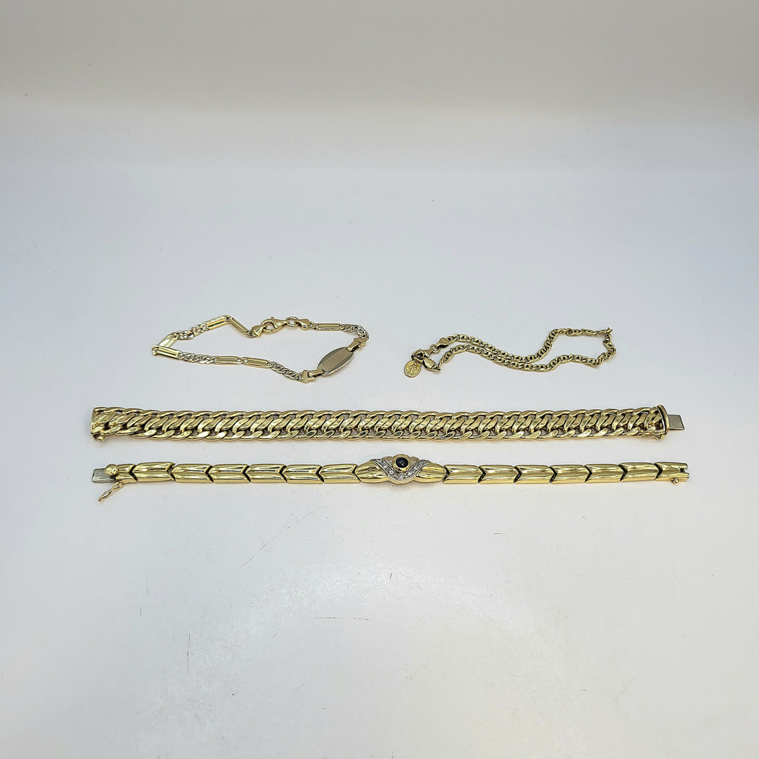 Quattro bracciali oro