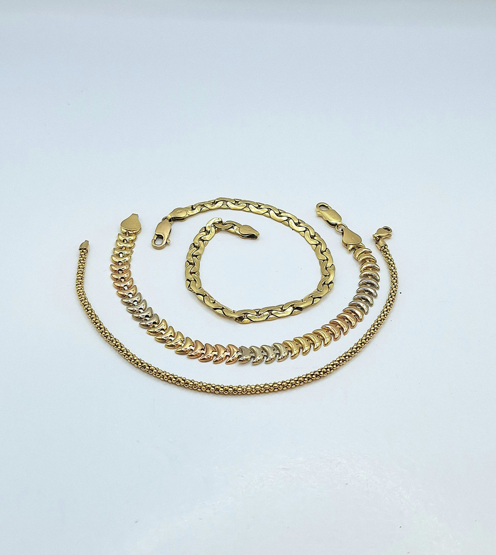 Tre bracciali oro