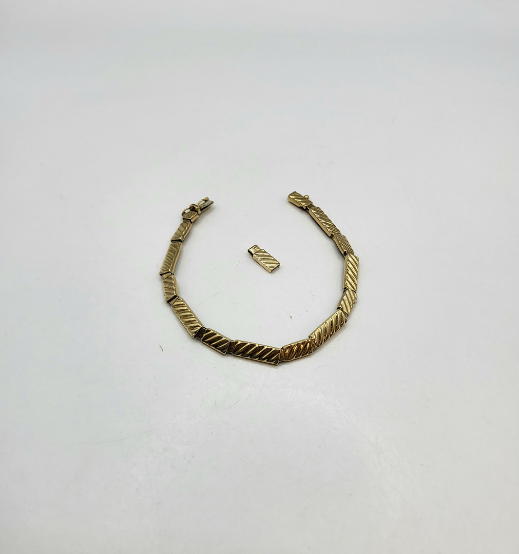 Bracciale oro e medaglia