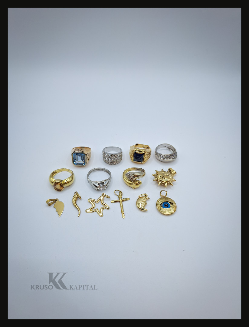Sette anelli e sette ciondoli oro diamanti pietre
