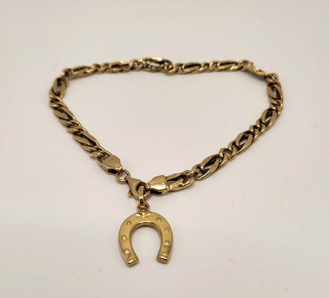Bracciale e ciondolo oro