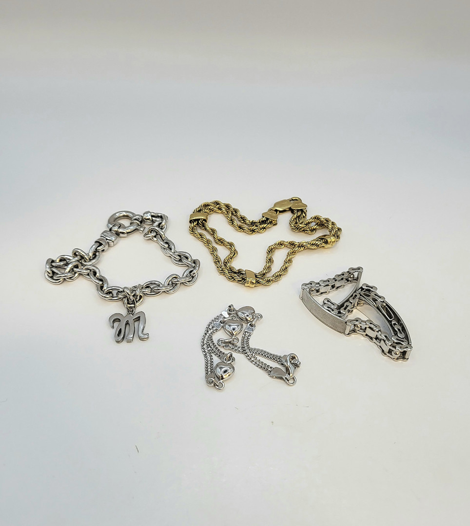 Quattro bracciali oro