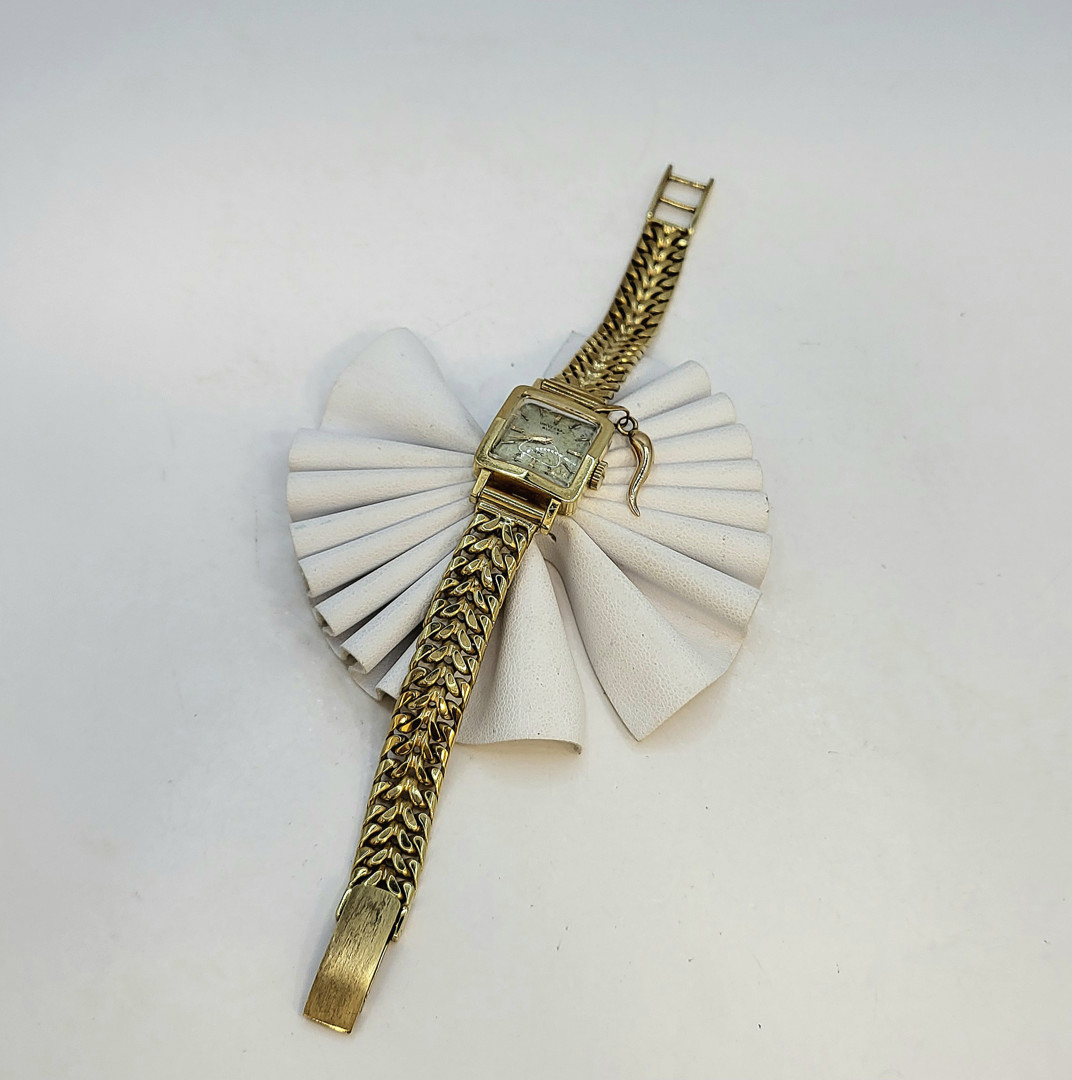 Orologio e ciondolo oro