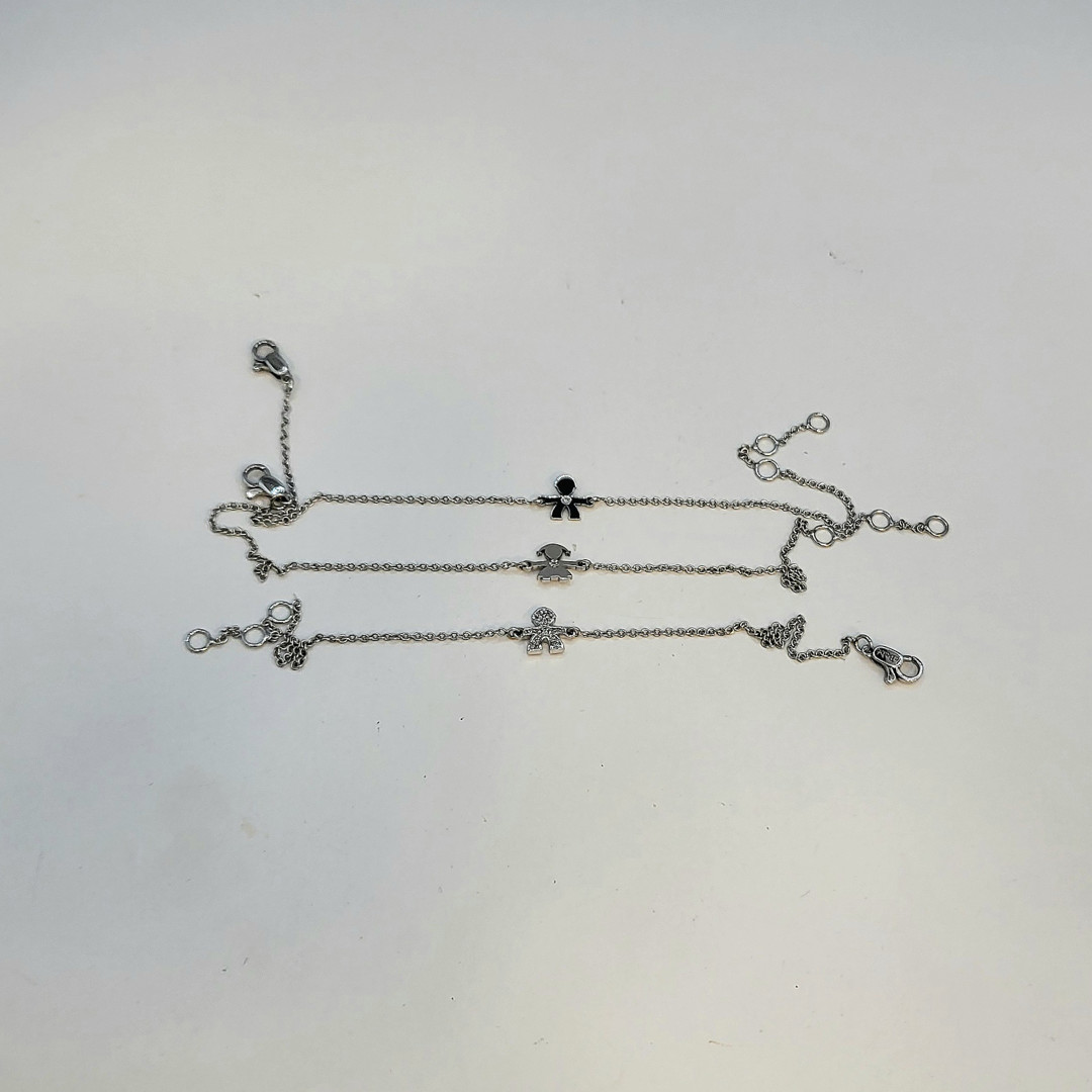 Tre bracciali oro diamantini a firma Le Bebè